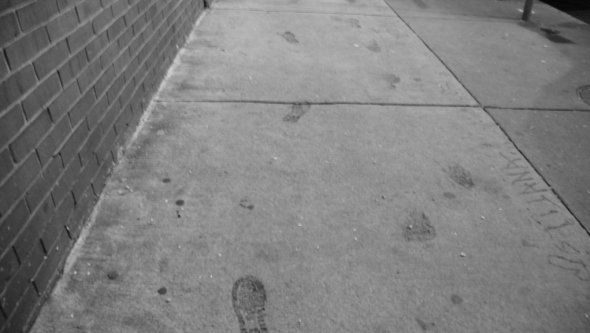 Footsteps in the wet concrete.